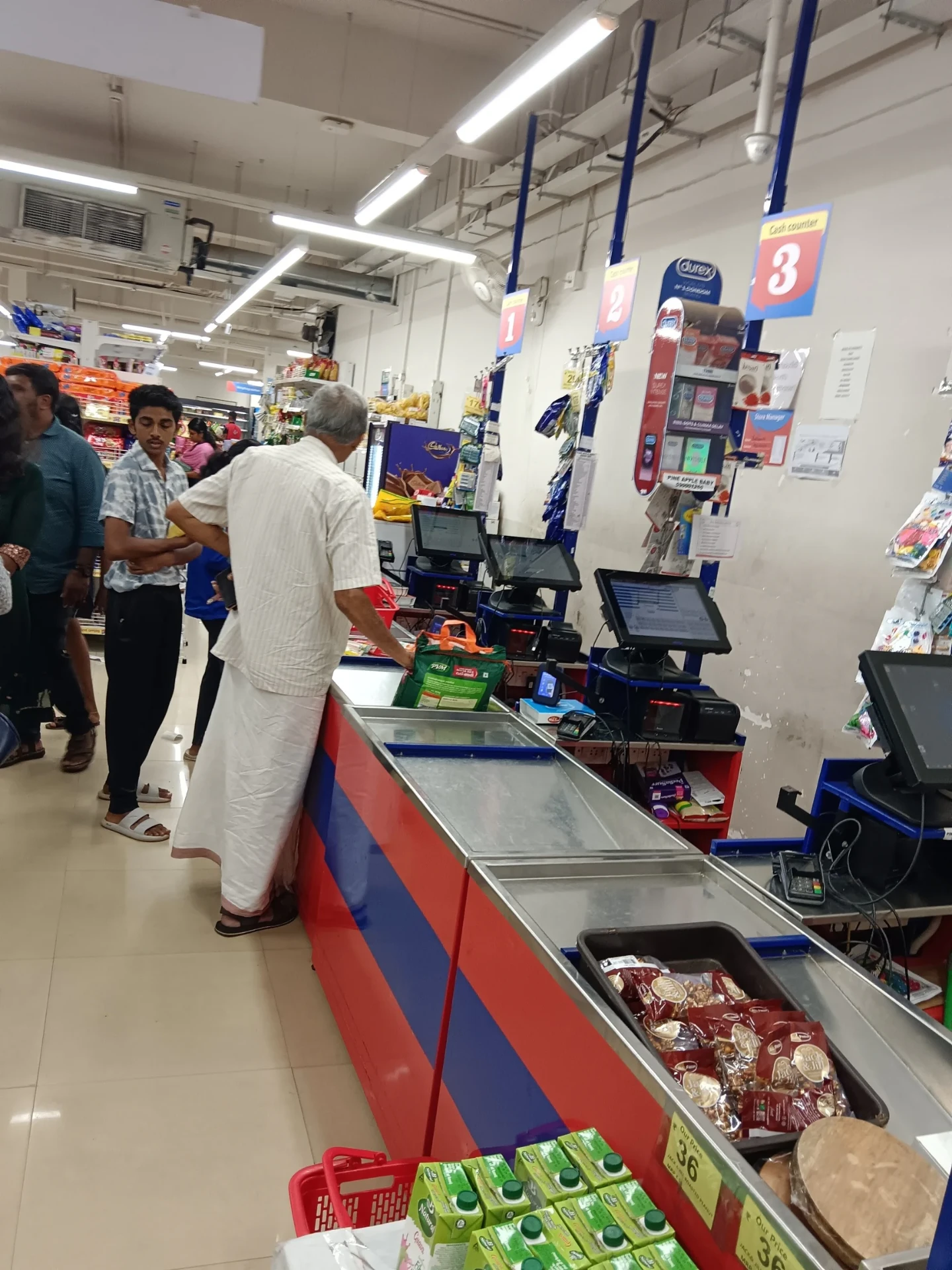 Crowded checkout counter — the friction of modern retail